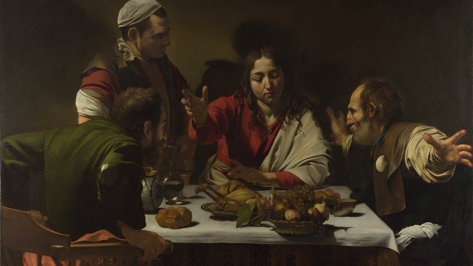 Caravaggio's Supper at Emmaus. Christ blessing the bread at table as two disciples recognise him.